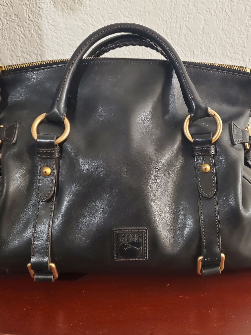 Gently used Dooney & Bourke Black Leather Tote with Gold Hardware